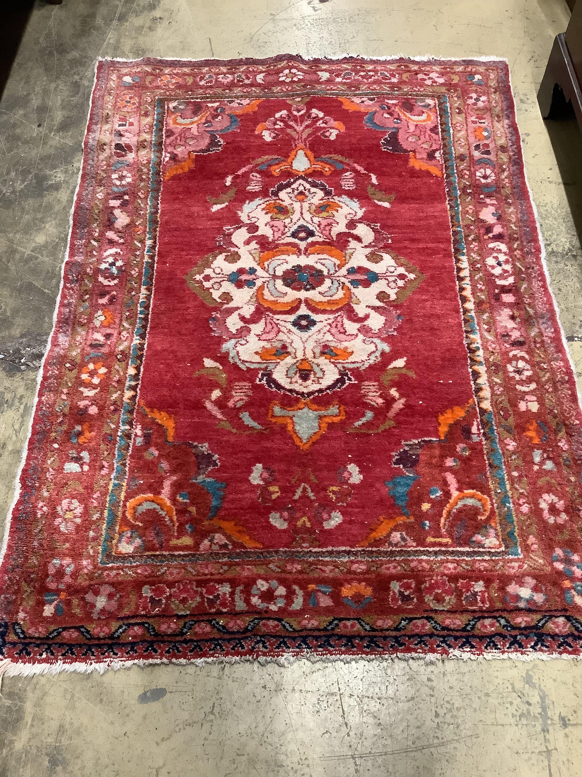 A Turkish red ground rug, 150 x 106cm